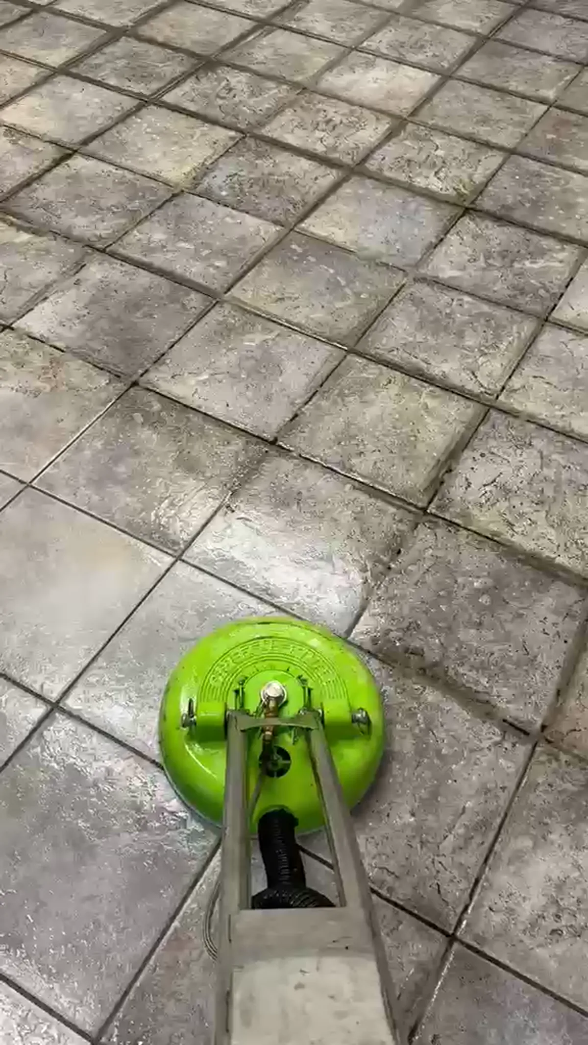 Dark grout lines between clean tiles before professional cleaning